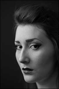 Monochrome Noir portrait photograph of a woman.