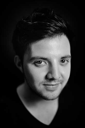 Low key monochrome portrait photograph of a man in Staffordshire